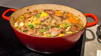 french meal with potatoes, carots and pork