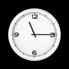White round analog wall clock isolated on black background.
