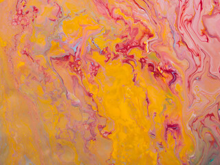 Beautiful abstract background. Pouring acrylic paint on canvas.
