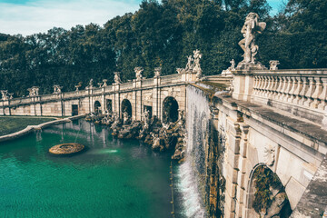 Naklejka premium Fountain with stone sculptures in the gardens of the royal palace of Caserta, Italy 