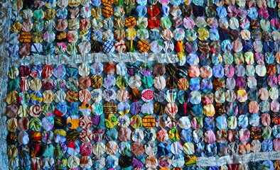 Fabric circles with lace forming a quilt