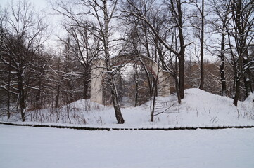 ancient brick arch in a snow-covered park