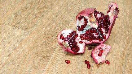 pomegranate seeds on wooden background