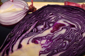 Obraz premium Still life of fresh purple vegetables on a gray background. Collection of fresh purple vegetables, Vegetable background