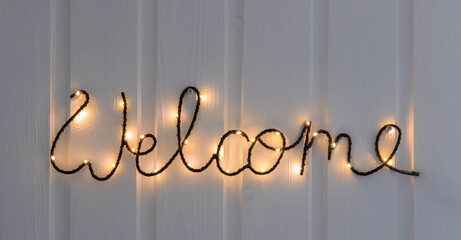 welcome sign made of metal wire with LED lights