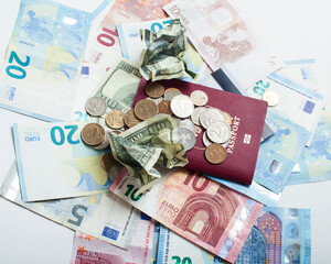 Cash on table isolated: dollars, euro, rubl broken money. All in mess, global crisis . passport travel concept