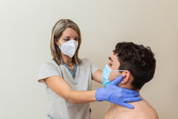 woman physiotherapist with mask does massage. Cervical manipulation, thrust