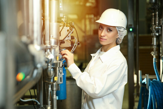 Female Engineer Conducting An Inspection In A Production Hall At A Food Factory