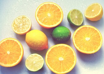 Fototapeta na wymiar Bright and mouth-watering citrus fruits: lemon, lime, orange