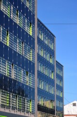 Fototapeta premium The walls of the building are tiled with solar panels. 