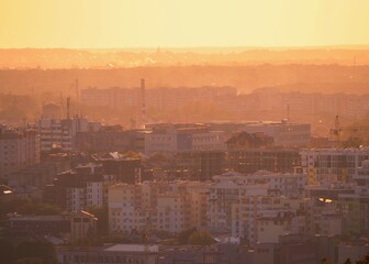 Top view of the panorama of the evening city in the sunlight