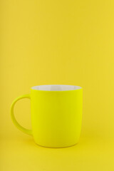 empty mug on yellow background