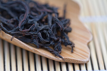 Oolong Tea leaves in teaspoon,close-up