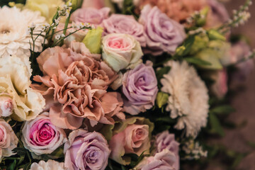 Close up of a colourful flower arrangement, made form carnations and roses