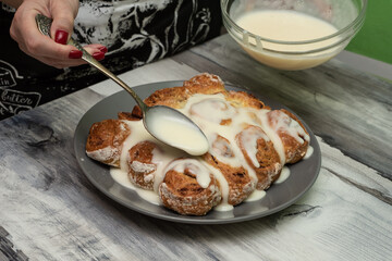 Beautiful fresh cinnamon rolls. The cooking process. Fresh fragrant pastries. Raw dough for buns.The process of making buns sinabon.