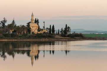 Hala sultan Tekke Muslim shrine mosque reflected on the lake in the morning. Larnaca Cyprus