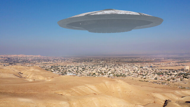 Alien Spaceship ufo Flying over city in the desert - aerial view
, drone view over Jericho city in Palestine with visual effect element, invasion sci fi concept
