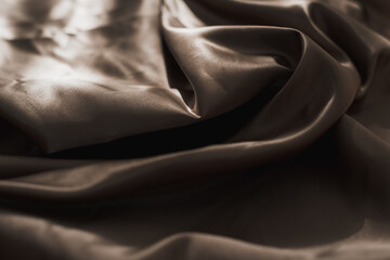 Obraz premium Brown atlas or silk fabric background, texture.