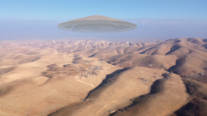 Large Alien spaceship sacuer ufo over desert maountains, aerial view
, Drone view over wide desert...
