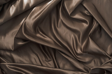 Obraz premium Brown atlas or silk fabric background, texture.