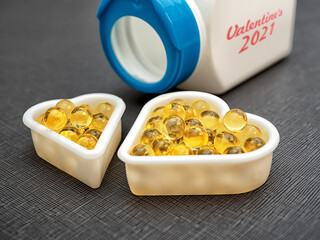 Two hearts made with vitamin D capsules Valentine's Day.