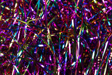 Festive background. Lots of multicolored tinsel close-up.