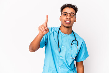 Young african american curly nurse man isolated showing number one with finger.