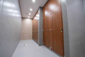 Public toilet doors wood grain