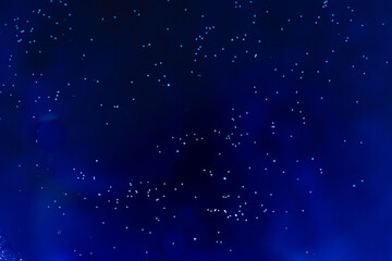 Oil with bubbles on colorful background.