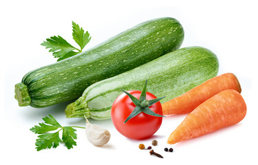 vegetables assorti with zucchinies tomato and carrots isolated white backgound