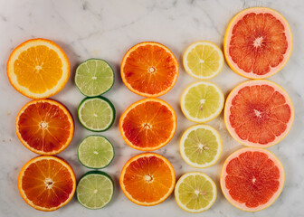 Colorful fruit background top view. slices of red orange, lime, lemon, grapefruit are on white background. Fresh citrus fruit rich of vitamins, healthy nutrition. Orange color