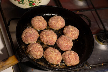 Cooking meat cutlets. meatballs are fried in a pan.