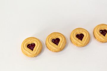 Heart-shaped sweet biscuits, isolated on a white background.