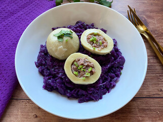 Classic Austrian dish. Blue cabbage with sausage dumplings.