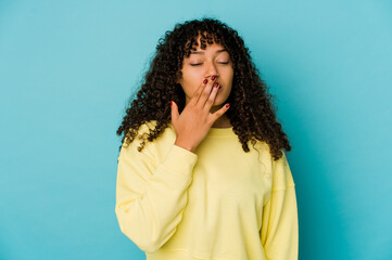 Young african american afro woman isolated yawning showing a tired gesture covering mouth with hand.