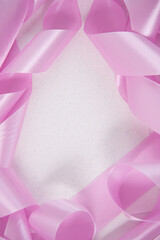 Christmas garlands and ribbons close-up. White shiny background, space for text. Background and texture of the New Year and Christmas