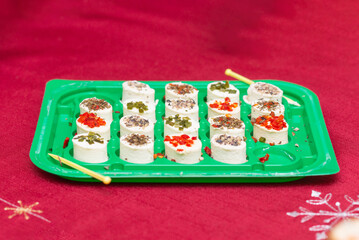 Cottage oval cheese with spices on a plate