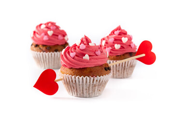 Cupcake decorated with sugar hearts and a cupid arrow for Valentine's Day