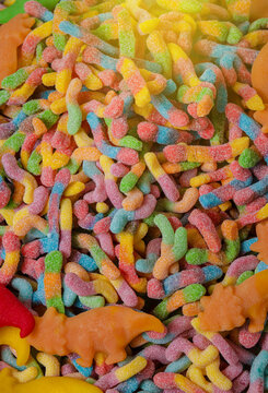 Colorful Fruity Gummy Worm Candy on a background