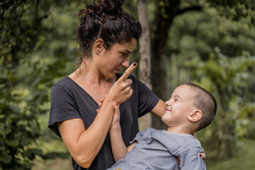 Mother getting mad at her child. Boy did something wrong and made his mom angry. 