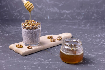 Healthy breakfast: chia seeds with yogurt, walnuts and honey.