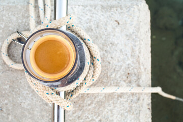 Cup of coffee at the dock.