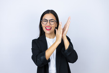Beautiful business woman clapping and applauding happy and joyful, smiling proud hands together