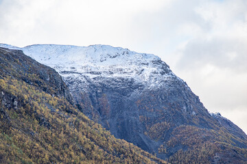 Yellow valley with snow mountains on the side near Skibotn in Norway