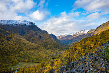 Yellow valley with snow mountains on the side near Skibotn in Norway