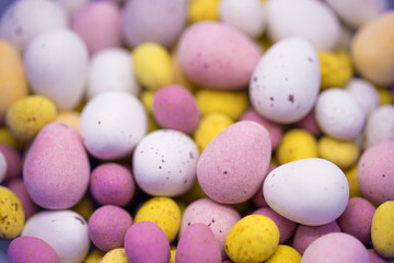 Chocolate Easter eggs on a colourful background. Springtime treats
