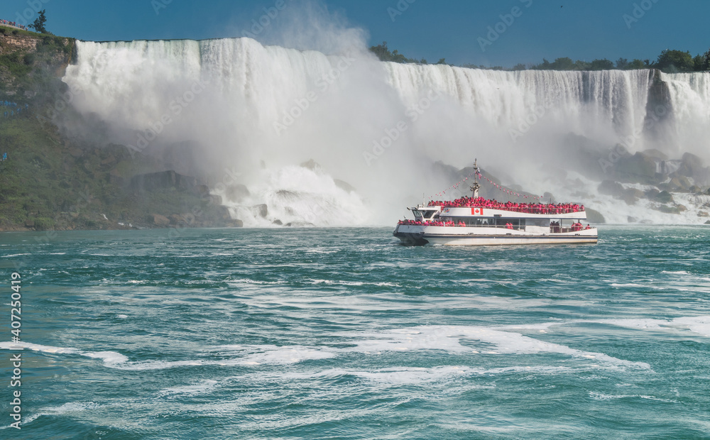 Wall mural tourist boat with niagara falls in the background