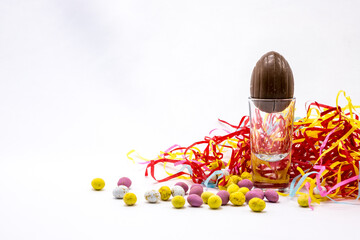 Chocolate Easter eggs on a white background. Colourful decoration for springtime easter celebration