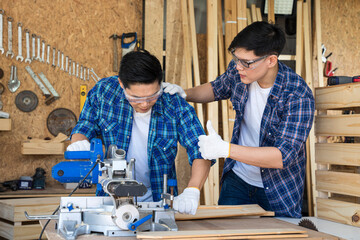 Carpenter is working with cutters and wood to make furniture.