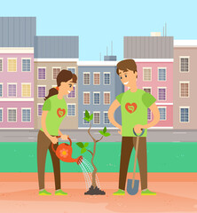 Two smiling volunteers planting tree. Man holding shovel, woman watering. People working in garden. Couple of gardeners, farmers planting seedling in the park against the background of city buildings